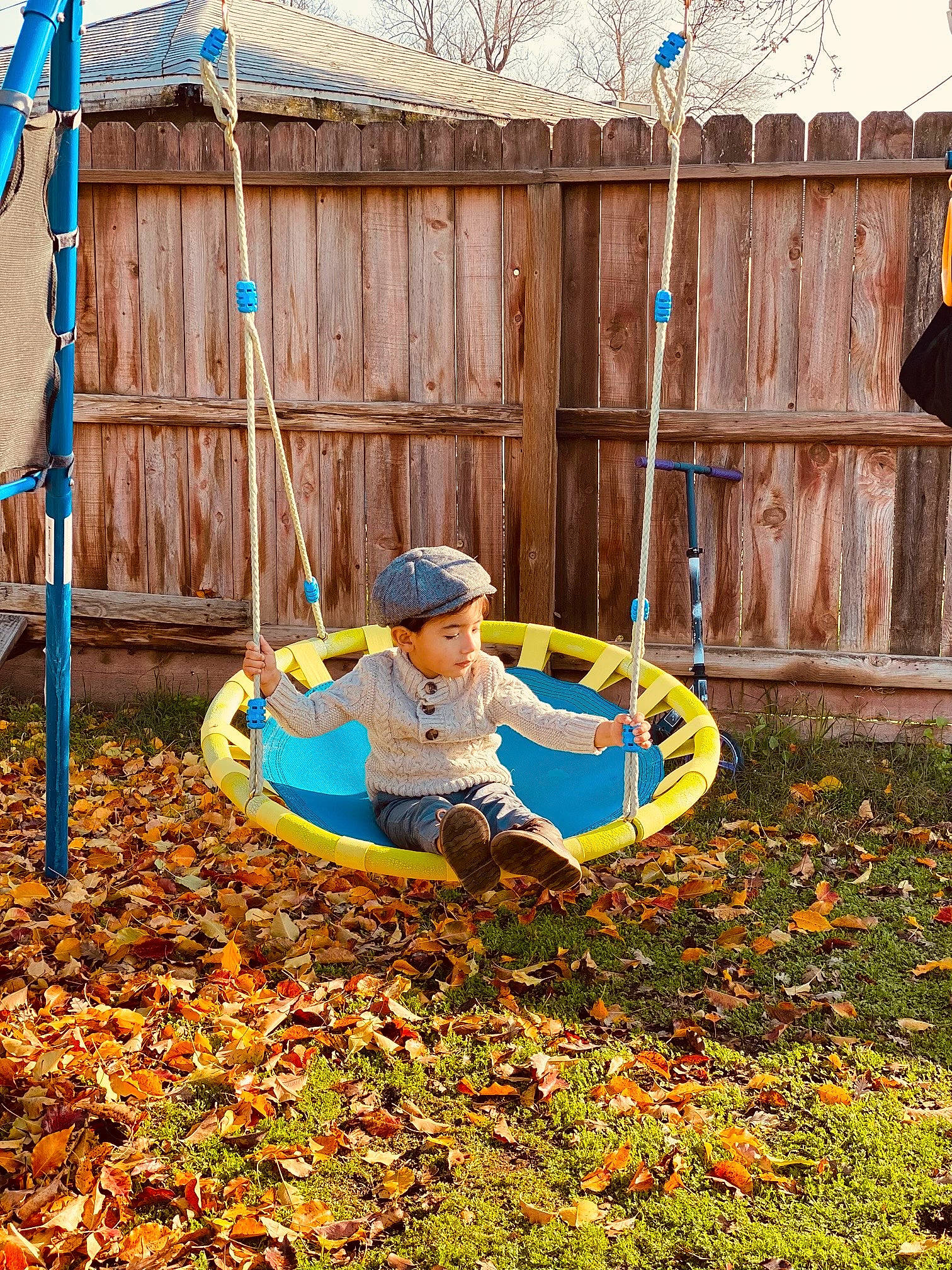 Zechariah is registered to the contest to win money with this photo: backyard, city, fun, garden, grass, groundcover, hat, headwear, landscape, landscaping, lawn, leisure, outdoor_play_equipment, people_in_nature, person, play, playground, recreation, soil, toddler