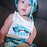 apparel, baby, blue, child, couch, cute, expression, four_months, furniture, hat, indoors, infant, person, portrait, sign, sitting, summer, tropical_clothing, white, young