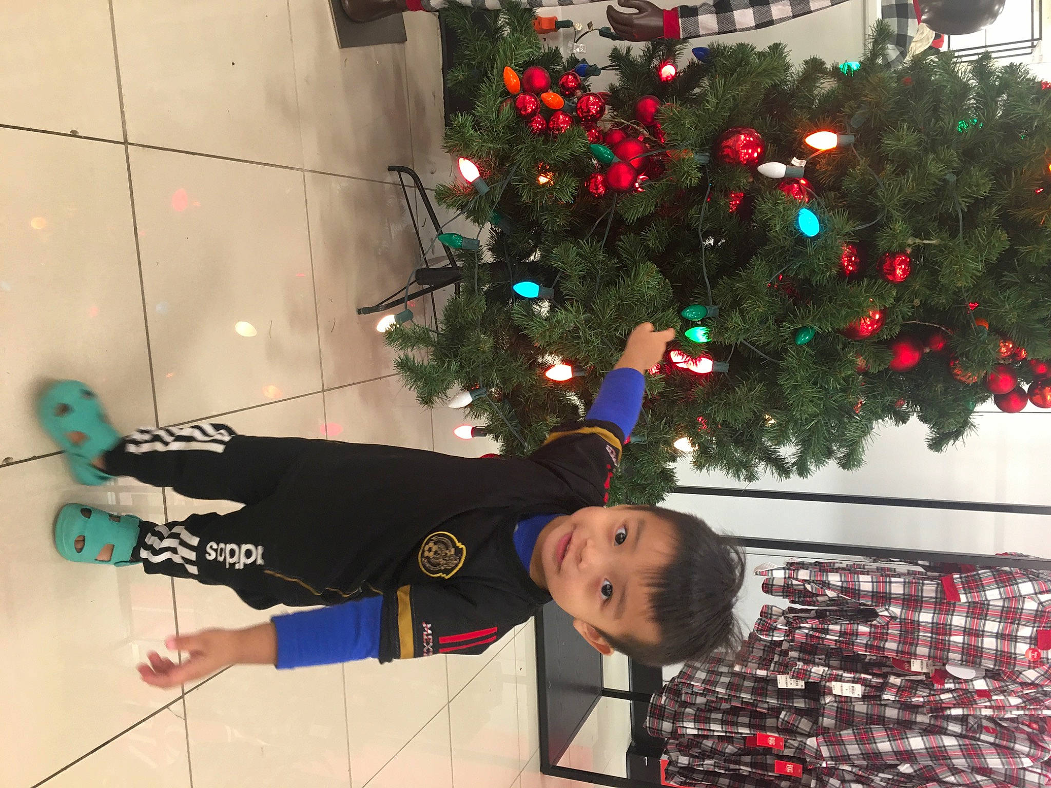 Evan joined the competition — help win amazing prizes! christmas, christmas_decoration, christmas_eve, christmas_ornament, christmas_tree, conifer, event, fir, fun, happy, holiday, holiday_ornament, houseplant, interior_design, ornament, person, plant, room, toddler, tree