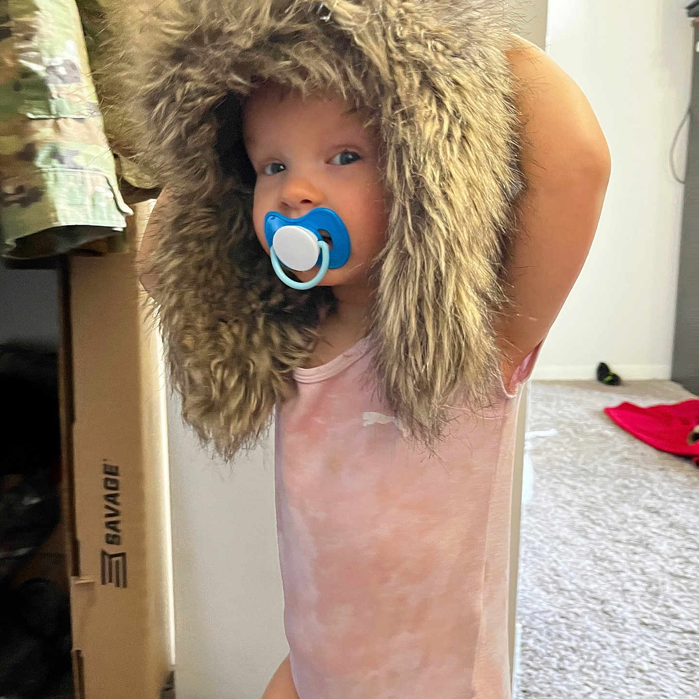 Ellianna is registered to the contest to win money with this photo: baby, bonnet, cap, clothing, costume, couch, door, dress, face, fashion, fur, furniture, hat, head, hood, person, photography, plush, portrait, toy