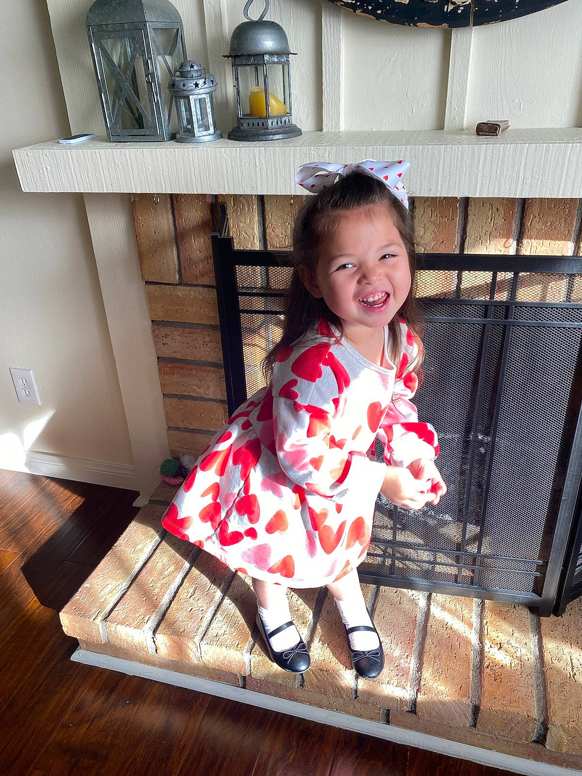 Kannika joined the competition — help win amazing prizes! baby, baby_toddler_clothing, child, dress, floor, flooring, happy, hardwood, human_leg, joy, pattern, person, room, sitting, sleeve, smile, tableware, toddler, varnish, white