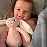 Sydney is registered to the contest to win money with this photo: baby, smile, plush_toy, pink_bunny, blanket, bed, child, cute, soft, cozy, infant, happy, face, skin, comfort, home, toddler, lying_down, cuddly, sleepwear