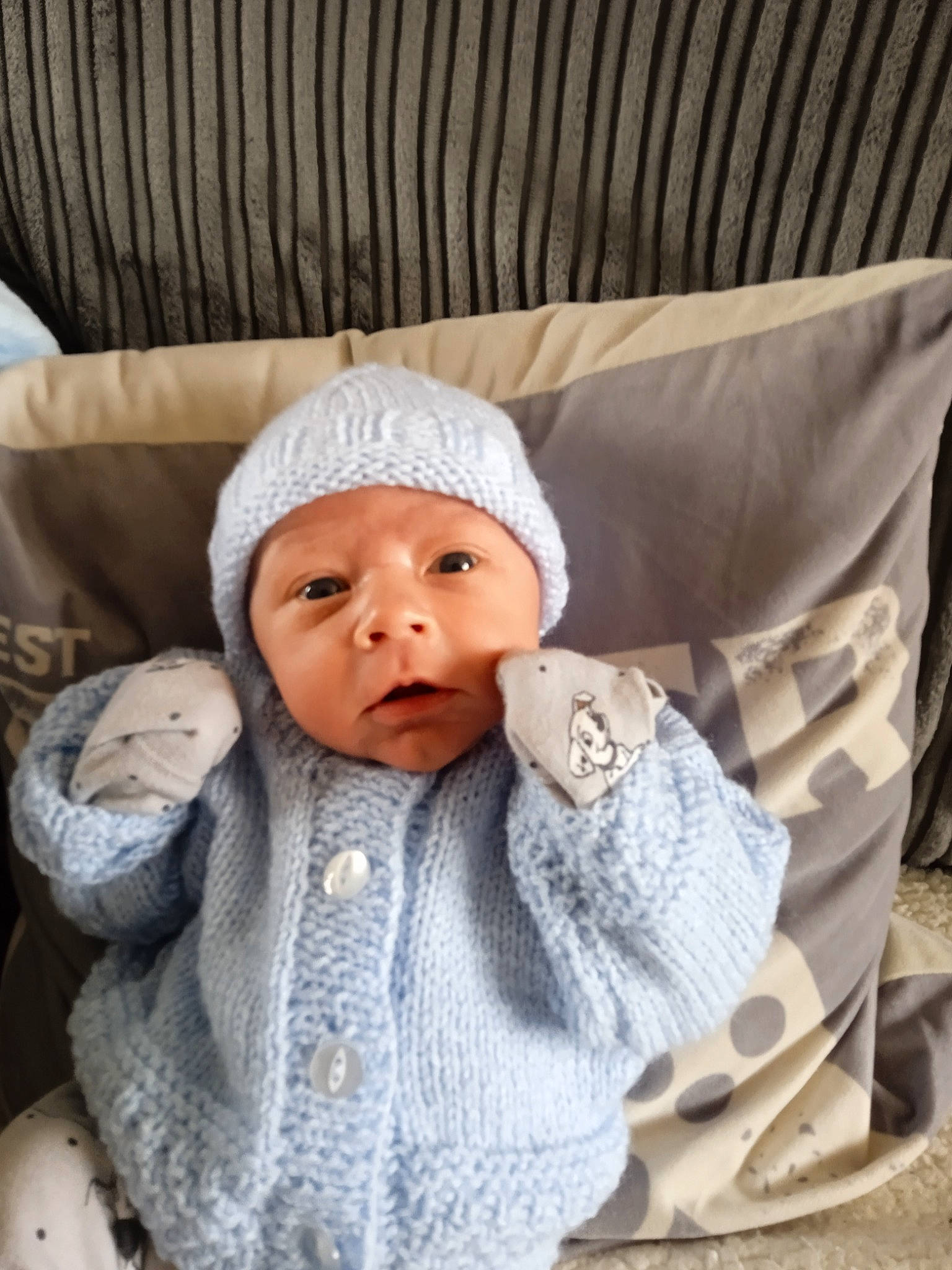 Karson joined the competition — help win amazing prizes! baby, baby_products, baby_sleeping, baby_toddler_clothing, beanie, cap, cheek, child, comfort, eye, fashion_accessory, head, headwear, knit_cap, linens, person, sitting, sleeve, textile, toddler