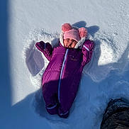 Harlow is registered to the contest to win money with this photo: baby, boot, bundled_up, child, cold, cute, infant, mittens, outdoors, pink_hat, play, pom_poms, portrait, purple, shadow, snow, snow_angel, snowsuit, snowy_ground, winter_hat