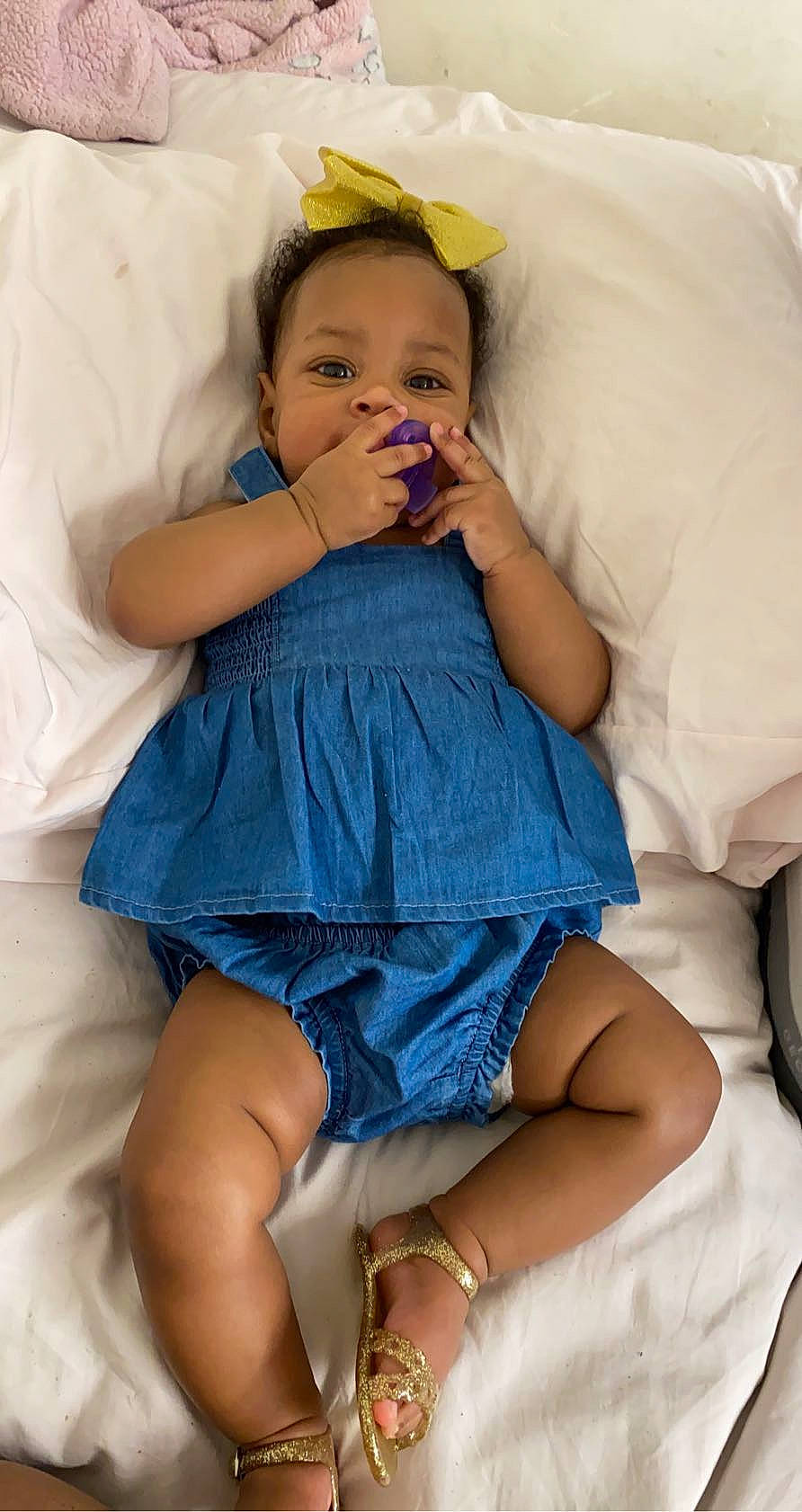 Ariah is registered to the contest to win money with this photo: arm, baby, blue, child, comfort, finger, human_leg, leg, linens, person, sitting, skin, sleep, thigh, toddler