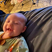 Annaleise is registered to the contest to win money with this photo: baby, smile, blurred, indoor, onesie, child, cushion, carpet, chair, happy, toddler, face, person, clothing, infant, blur, seated, home, cute, young