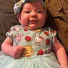 baby, bed, blanket, cartoon, child, clothing, colorful, cute, dress, face, happy, headband, indoor, infant, person, portrait, smile, toddler, tutu, young