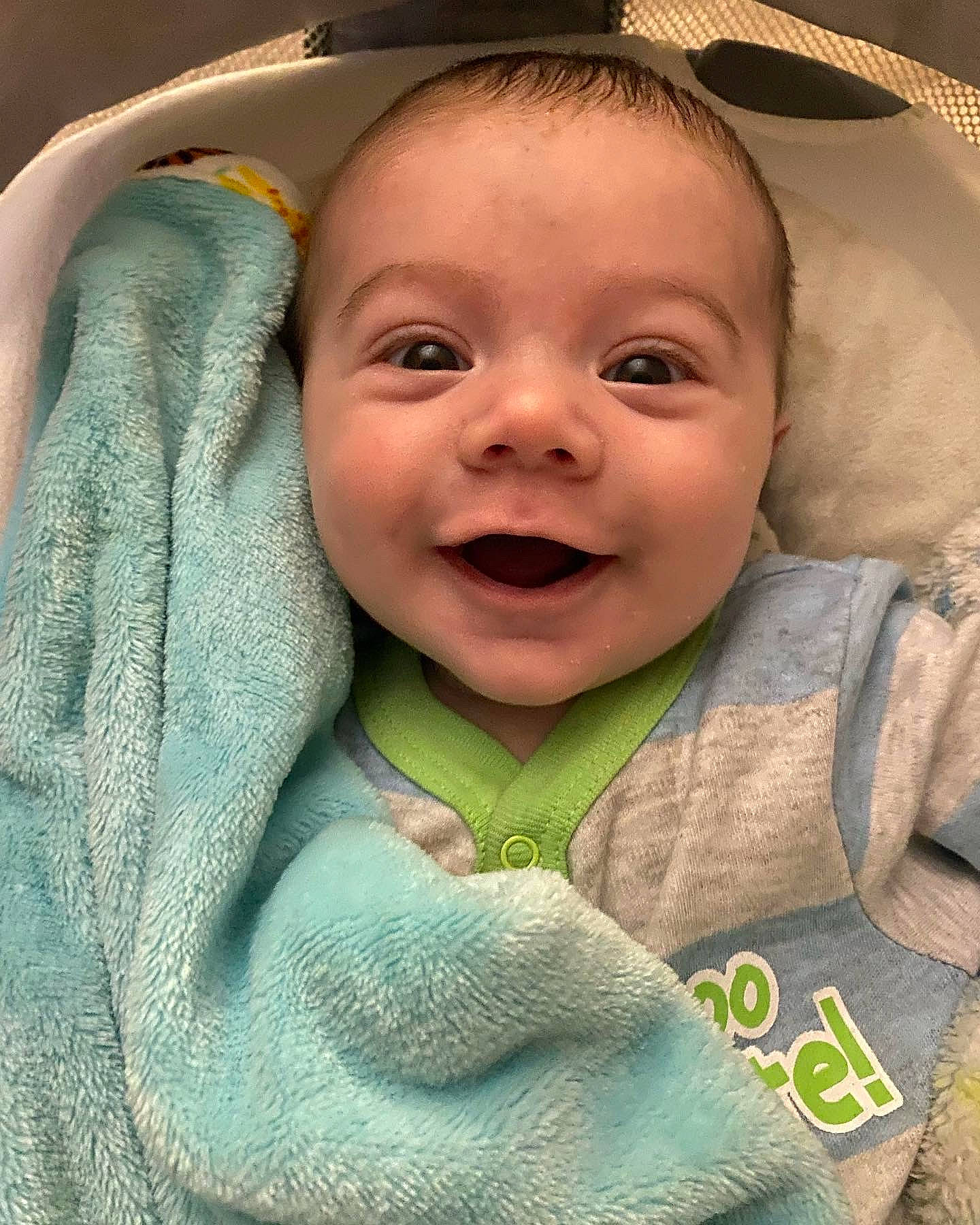 Jack is registered to the contest to win money with this photo: baby, baby_toddler_clothing, cheek, child, chin, comfort, eyebrow, facial_expression, gesture, happy, iris, linens, mouth, nose, outerwear, person, skin, sleeve, smile, textile