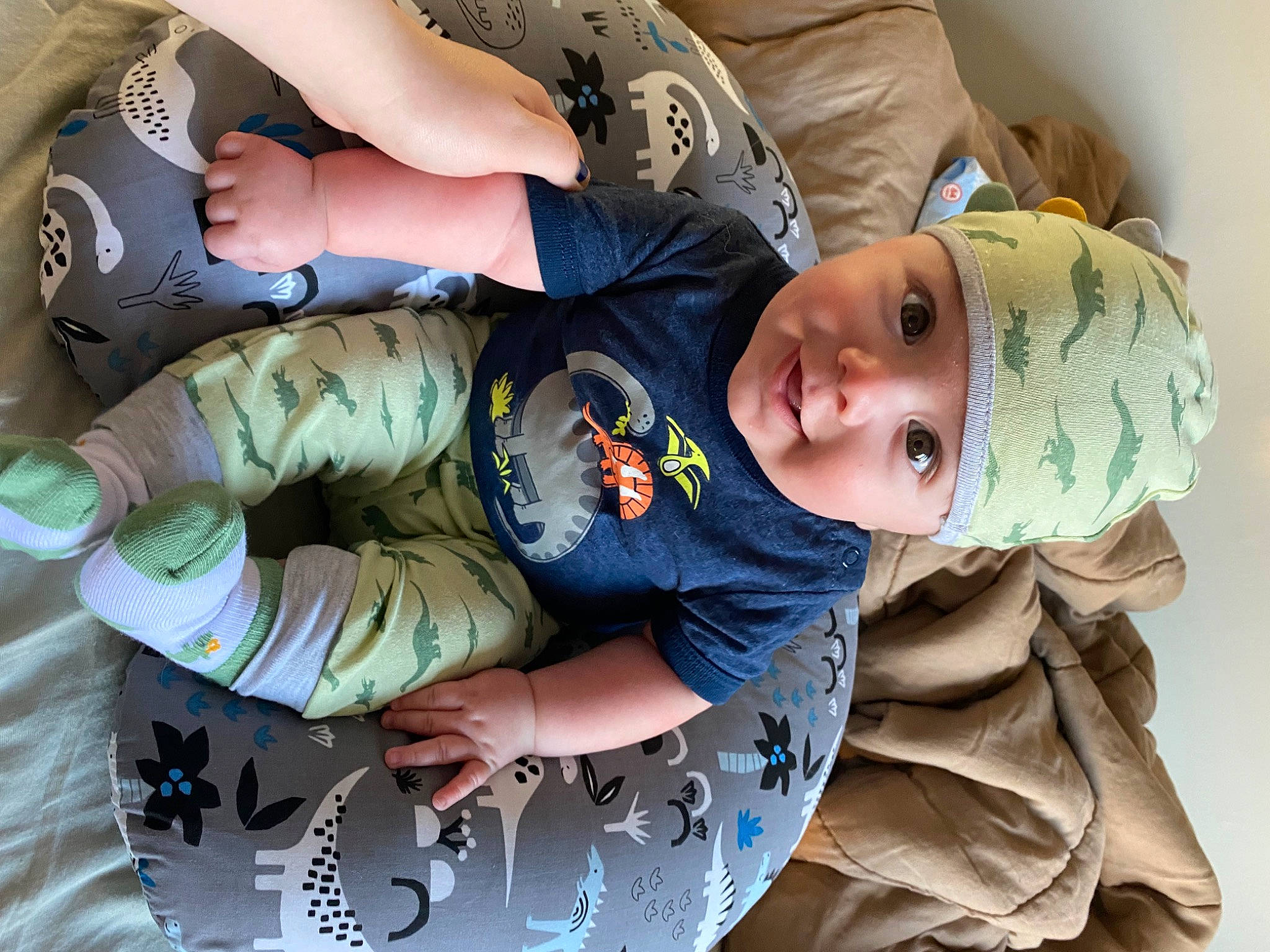 Jack is registered to the contest to win money with this photo: arm, baby, baby_products, baby_toddler_clothing, cheek, child, comfort, cool, elbow, eye, fun, hand, happy, headwear, mouth, pattern, person, sitting, skin, sleeve