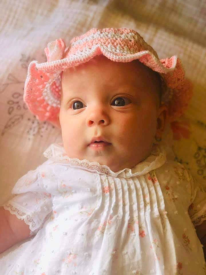 Mykah is registered to the contest to win money with this photo: baby, bonnet, cheek, child, eye, fashion_accessory, hair_accessory, head, headgear, headwear, lip, nose, person, pink, portrait, portrait_photography, skin, toddler