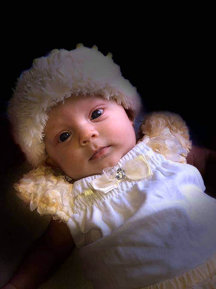 Mykah is registered to the contest to win money with this photo: baby, bonnet, cheek, child, fur, headwear, nose, person, smile, toddler
