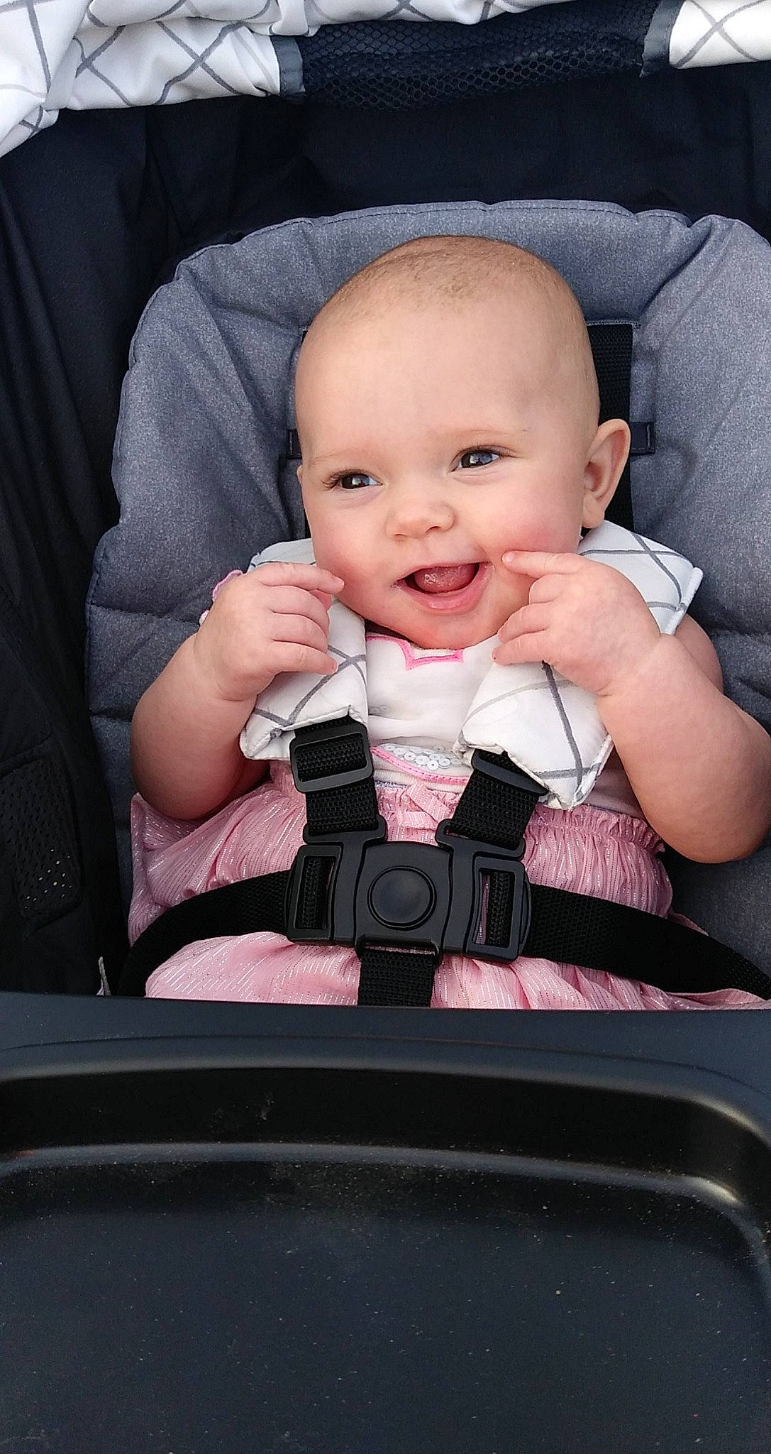 Ari'Ella is registered to the contest to win money with this photo: baby, baby_carriage, baby_in_car_seat, baby_products, car_seat, cheek, child, eating, finger, hand, joy, mouth, nose, person, product, seat_belt, sitting, thumb, toddler