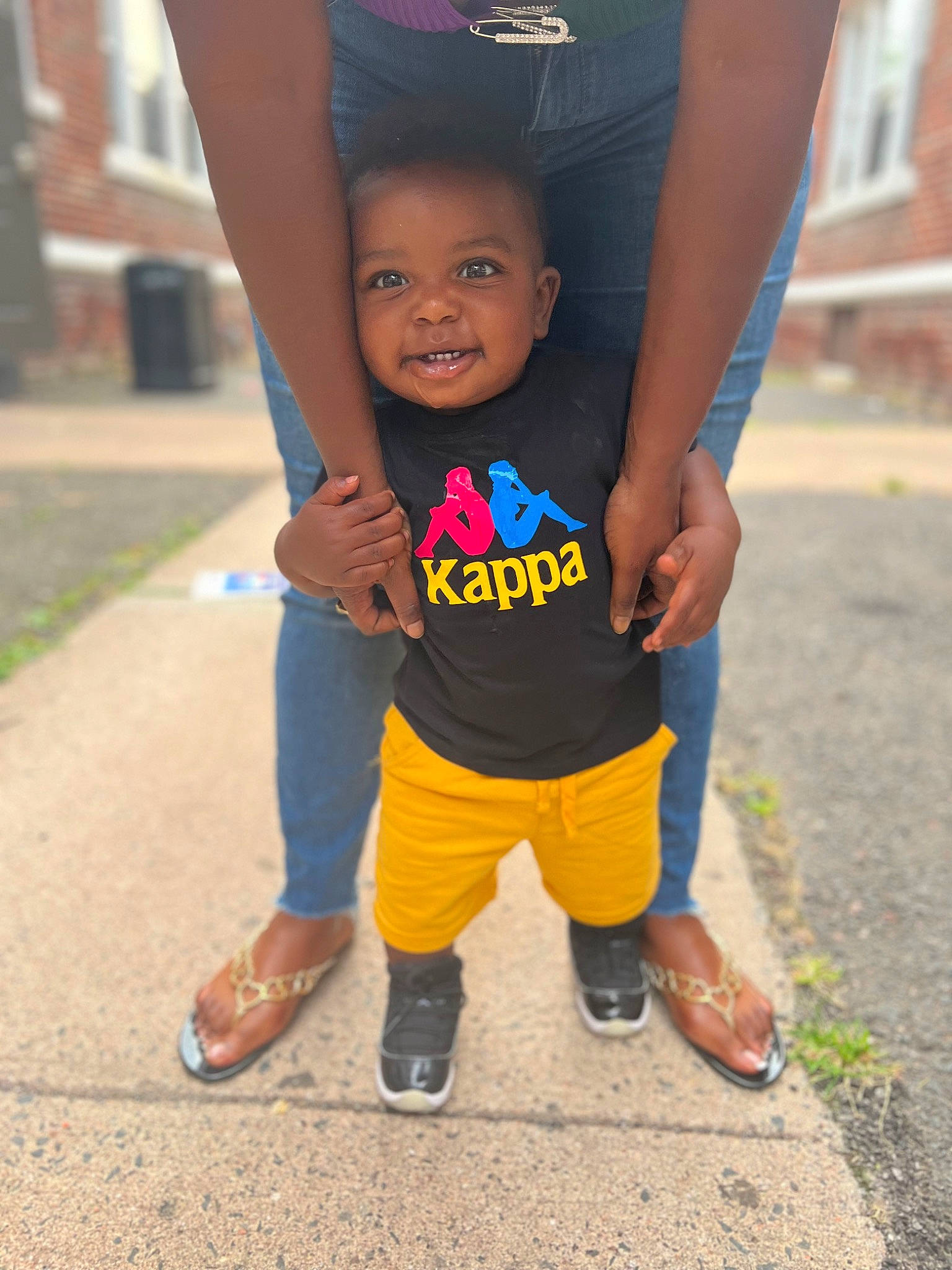 Makhi joined the competition — help win amazing prizes! asphalt, electric_blue, footwear, fun, gesture, happy, human_body, human_leg, leisure, person, recreation, sandal, shoe, smile, sneakers, t_shirt, thigh, thumb, toddler, trunk