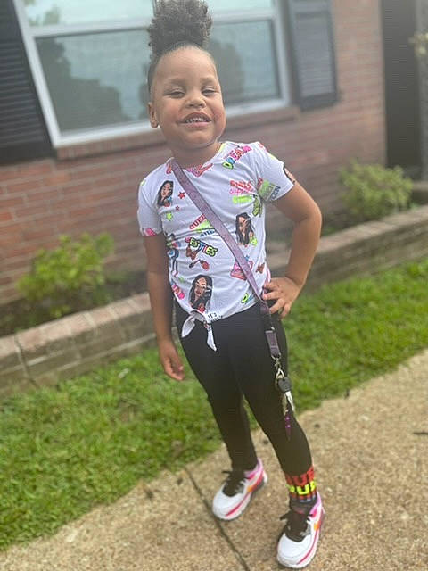 Serenity is registered to the contest to win money with this photo: active_pants, baby_toddler_clothing, blurred, child, eye, face, grass, hair, happy, head, joy, leisure, person, plant, recreation, sleeve, smile, sneakers, sweatpant, t_shirt