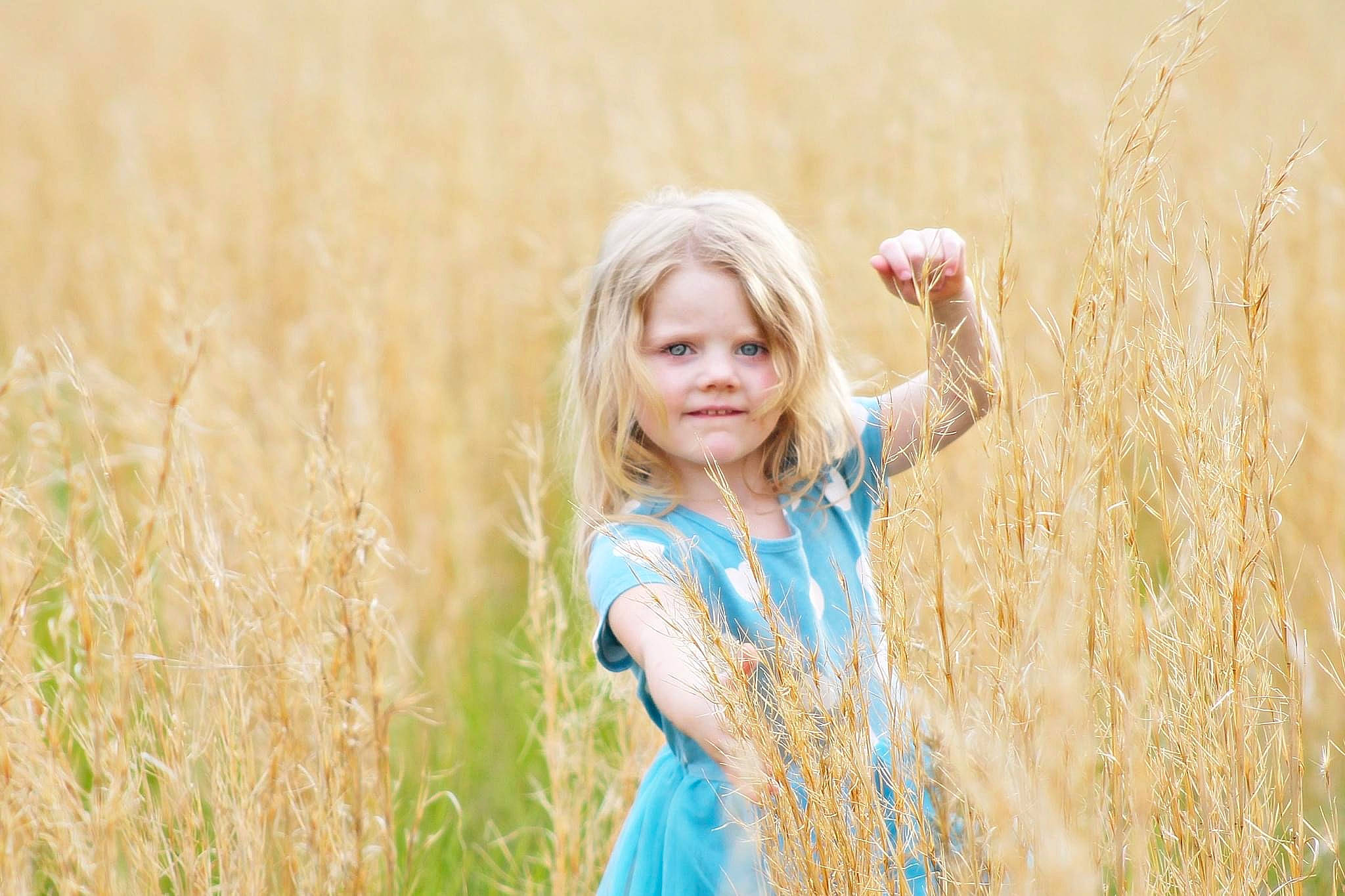 Mckynlee is registered to the contest to win money with this photo: agriculture, blond, brown_hair, ecoregion, fawn, field, flash_photography, fun, grass, grass_family, grassland, happy, joy, landscape, long_hair, meadow, people_in_nature, person, plant, prairie