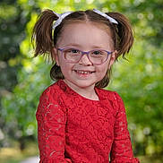 Madison joined the competition — help win amazing prizes! casual, child, childhood, cute, eyewear, face, fashion, girl, glasses, greenery, hair_bows, happy, nature, outdoor, person, pigtails, portrait, red_dress, smile, young