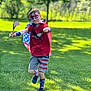american_flag, boy, cape, casual_clothing, celebration, child, daylight, face_paint, flag, fun, grass, happy, outdoor, patriotic, playful, red_shirt, running, shorts, socks, summer