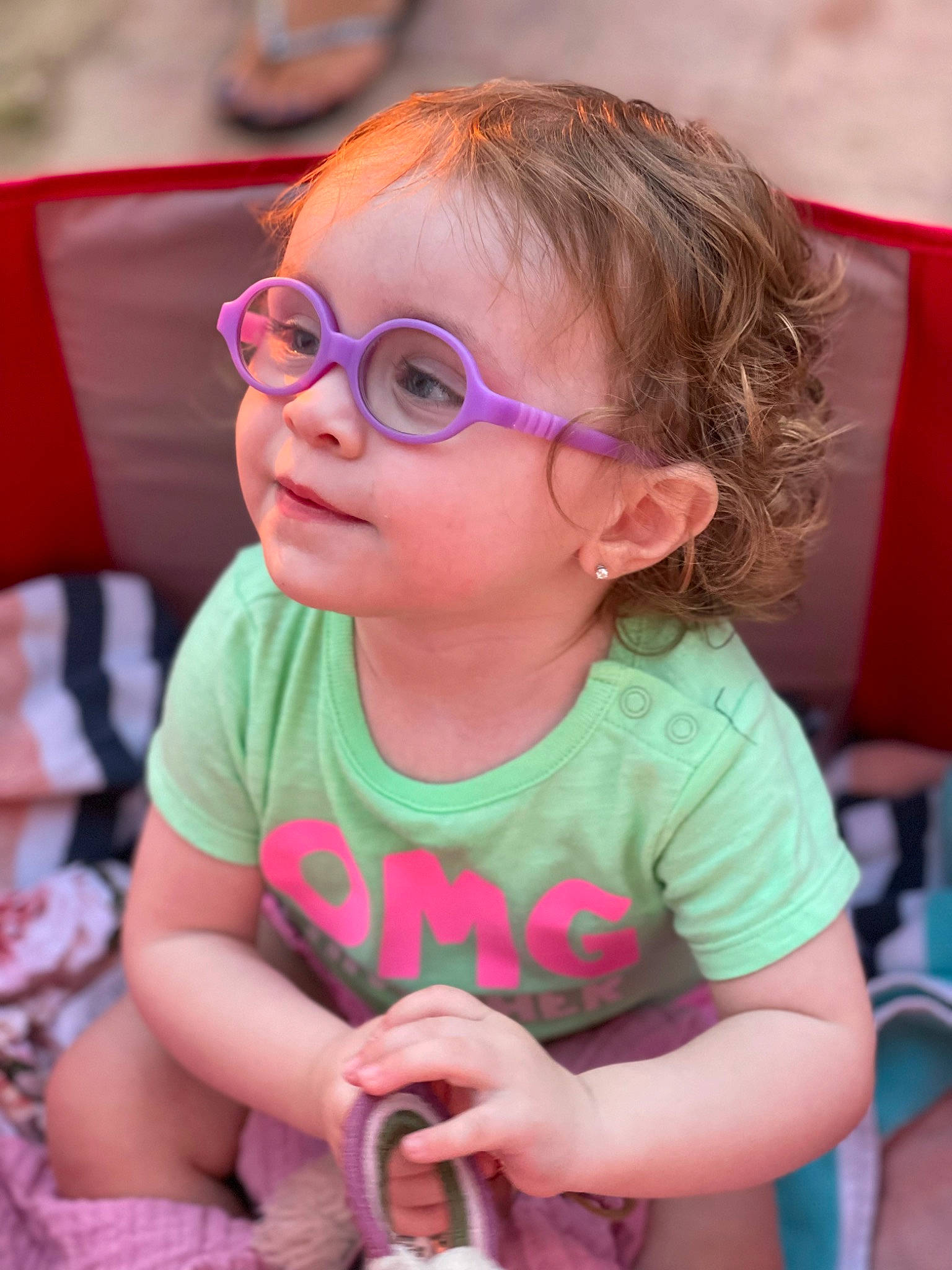 Madison is registered to the contest to win money with this photo: arm, baby_toddler_clothing, cheek, eyewear, facial_expression, fun, glasses, goggles, hairstyle, happy, head, mammal, mouth, organ, person, pink, purple, skin, summer, toddler