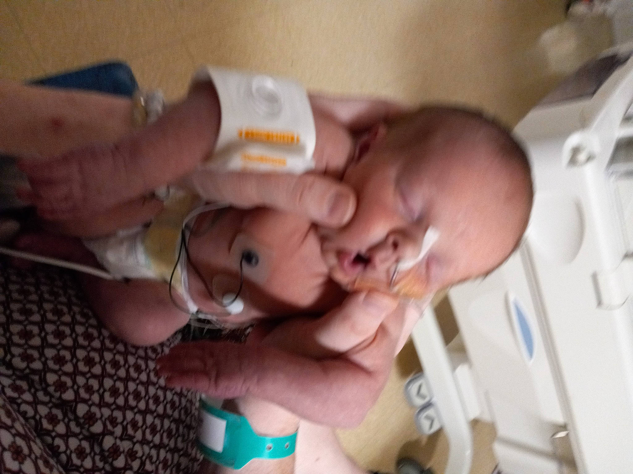 Sutton is registered to the contest to win money with this photo: baby, cheek, child, comfort, ear, event, eyebrow, eyelash, finger, hand, hospital, medical_equipment, medical_procedure, mouth, nail, nose, person, service, skin, thumb