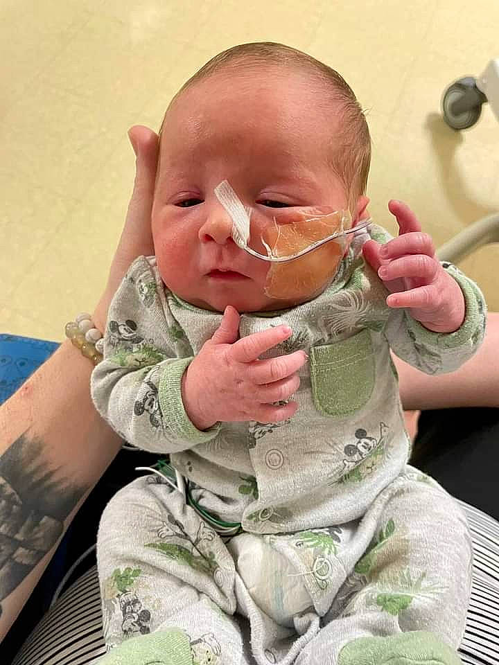 Sutton joined the competition — help win amazing prizes! baby, baby_toddler_clothing, camouflage, cheek, ear, eye, eyelash, finger, gesture, glasses, hair, hairstyle, hand, head, lip, mouth, nose, person, skin, sleeve