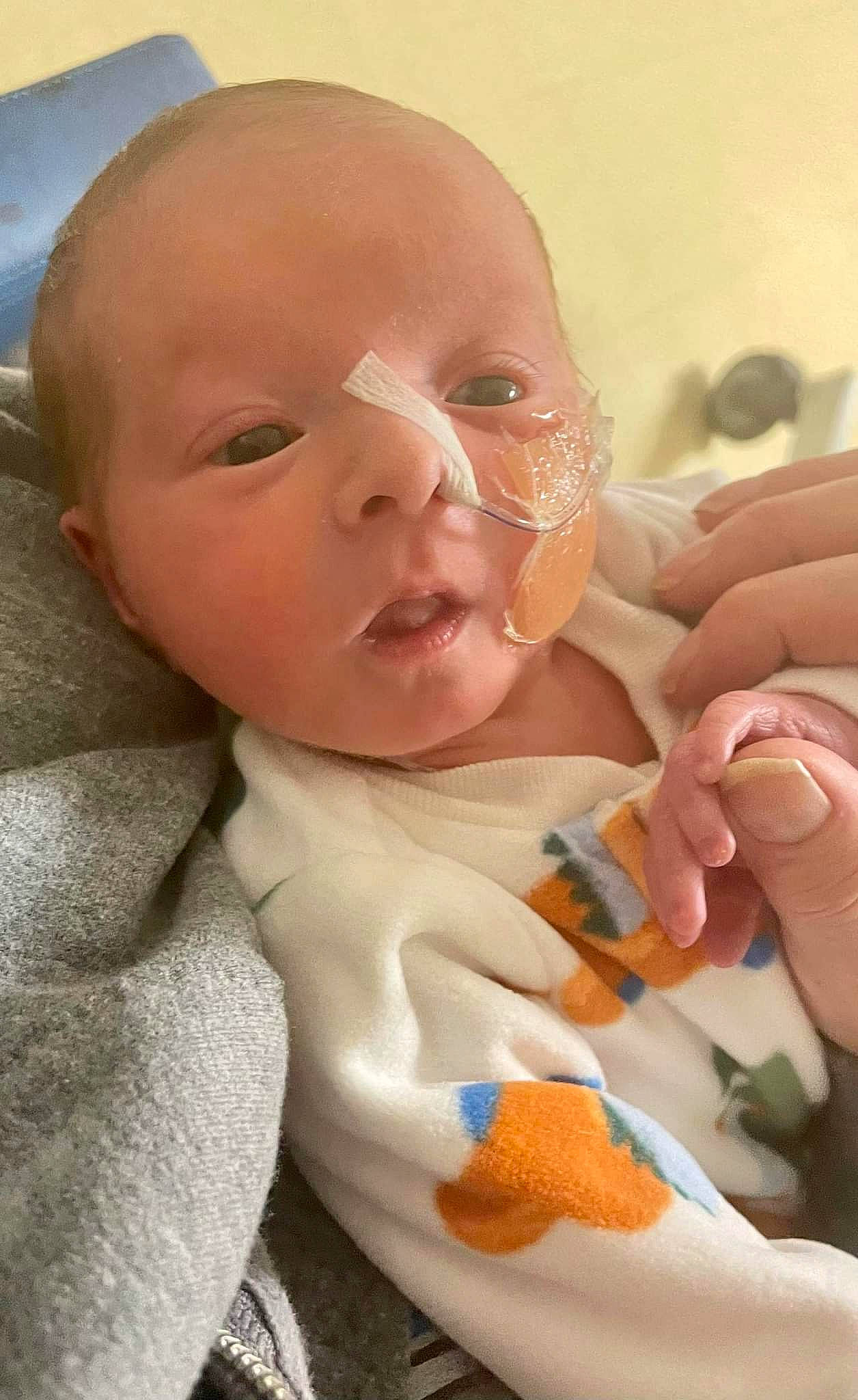 Sutton is registered to the contest to win money with this photo: baby, baby_products, baby_toddler_clothing, cheek, child, chin, comfort, event, eyebrow, finger, happy, iris, linens, mouth, nail, nose, person, skin, smile, thumb