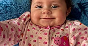 Heavenly joined the competition — help win amazing prizes! baby, infant, child, smiling, portrait, close_up, blue_teddy_bear, stuffed_animal, pink_outfit, ladybug, patterned_clothing, floral_pattern, lying_down, indoor, couch, blanket, happy, face, brown_hair, photography
