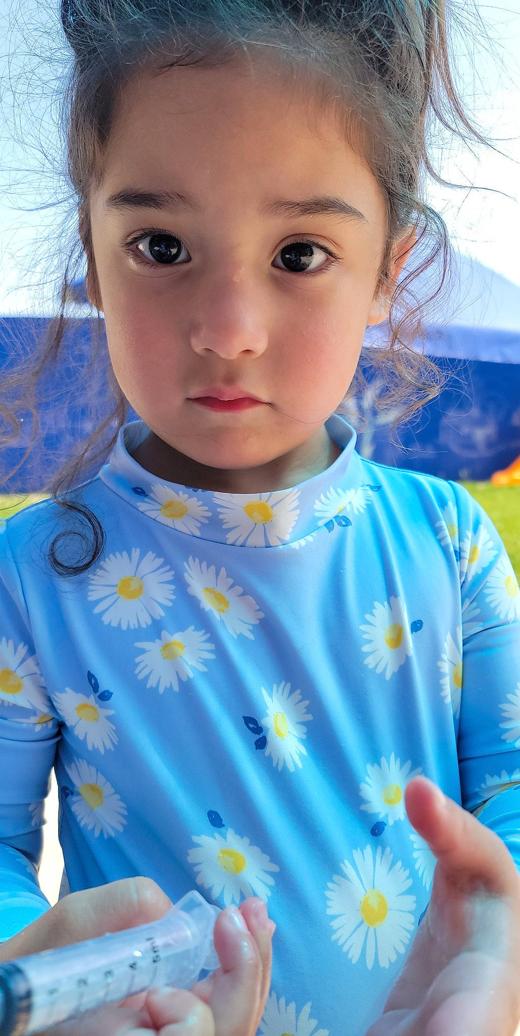 Layla is registered to the contest to win money with this photo: azure, baby_toddler_clothing, blue, eye, eyelash, face, grass, hair, happy, head, iris, light, lip, nose, outerwear, person, shoulder, skin, sleeve, toddler