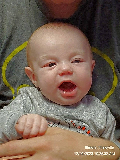 Archer is registered to the contest to win money with this photo: baby, baby_toddler_clothing, cheek, chin, comfort, ear, eye, eyebrow, face, facial_expression, gesture, happy, head, iris, lip, mouth, nose, person, skin, sleeve