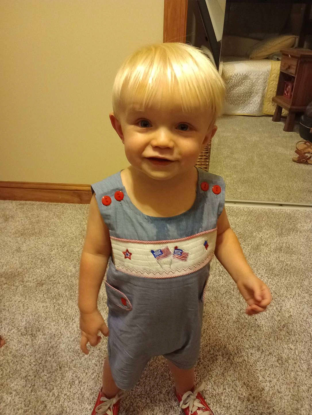 Asher is registered to the contest to win money with this photo: baby, baby_toddler_clothing, cheek, child, chin, face, flooring, fun, hair, happy, head, iris, joint, joy, nose, person, skin, sleeve, smile, standing