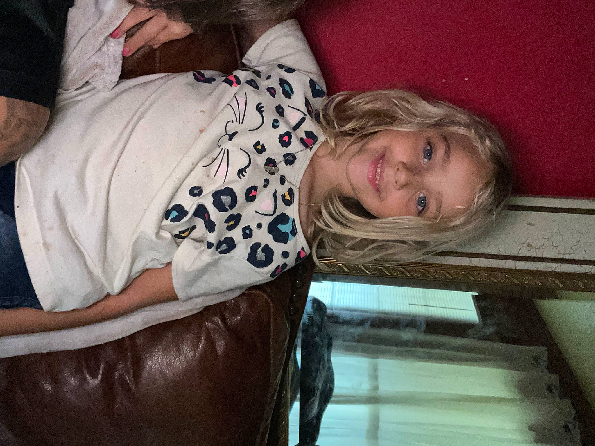 Anna is registered to the contest to win money with this photo: cheek, child, comfort, elbow, fun, gesture, happy, human_leg, joy, person, sitting, sleeve, smile, thigh, toddler, tree, vacation, wood