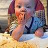 baby, child, messy, food, spaghetti, high_chair, face, hands, blue_eyes, cute, meal_time, clothing, indoor, expression, person, close_up, feeding, table, plate, funny