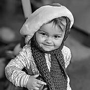 Vanya joined the competition — help win amazing prizes! toddler, child, smiling, knitted_scarf, hat, indoor, portrait, face, hand, clothing, winter_wear, cute, happy, baby, person, cozy, young_child, expression, warm, playful