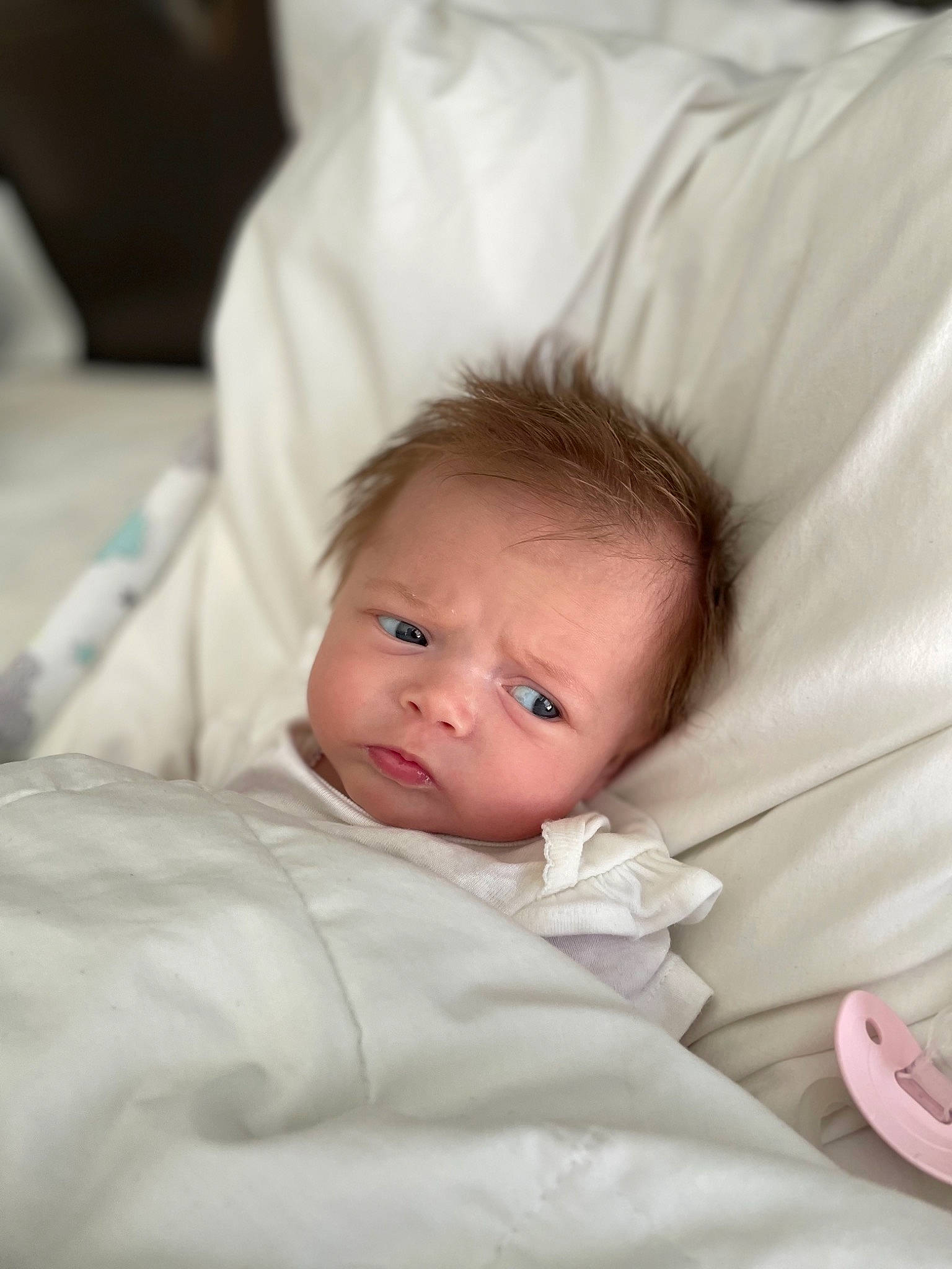 Octavia is registered to the contest to win money with this photo: baby, baby_toddler_clothing, bedding, cheek, chin, comfort, eye, eyelash, finger, fur, hair, happy, iris, linens, lip, nose, person, sitting, sleeve, smile