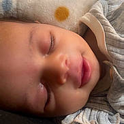 Ariyah joined the competition — help win amazing prizes! baby, sleeping, infant, portrait, face, closed_eyes, peaceful, blanket, swaddled, clothing, indoors, resting, cuddled, soft, plush, cozy, photography, head, calm, nap