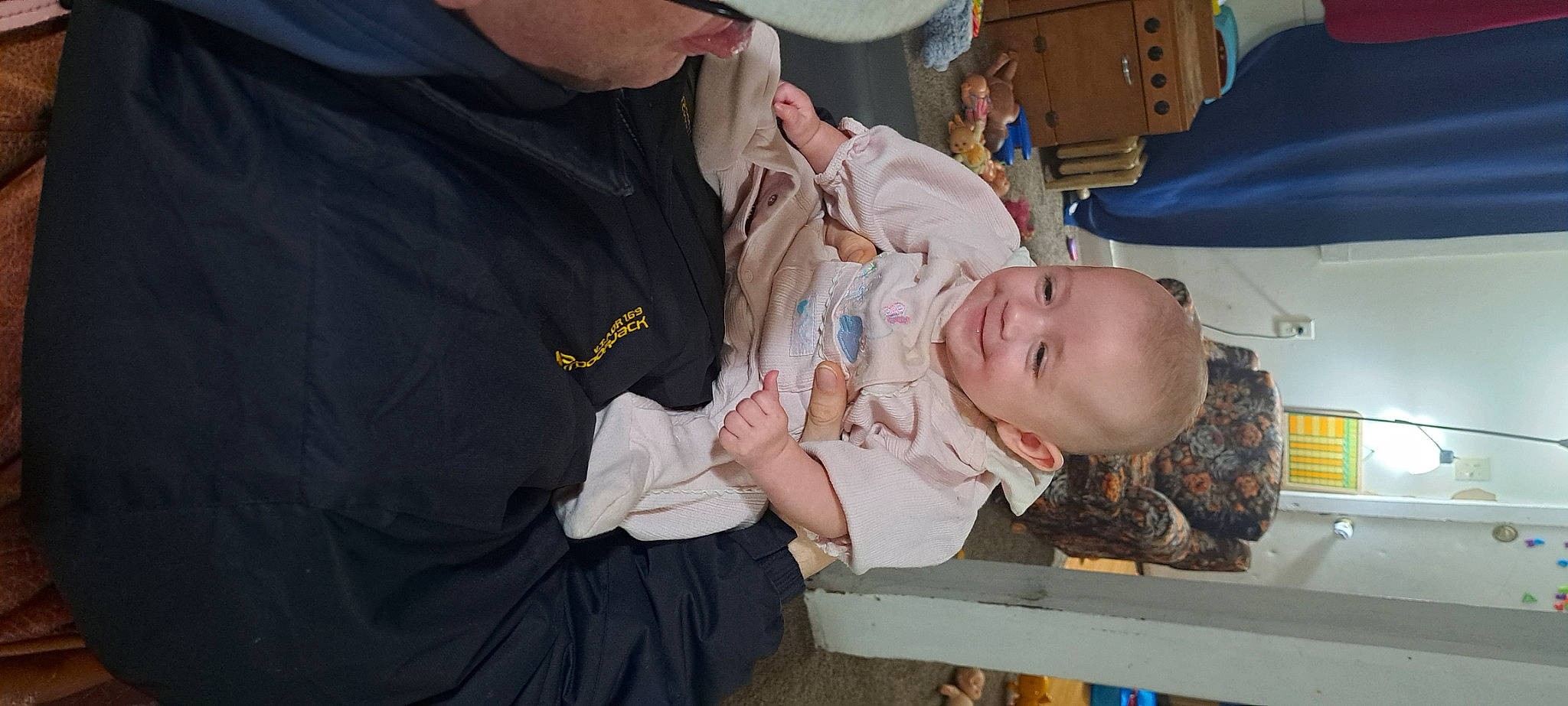 Brooklynn is registered to the contest to win money with this photo: baby, baby_products, baby_toddler_clothing, baseball_cap, cap, child, event, hat, health_care, joy, medical_procedure, person, room, service, smile, toddler