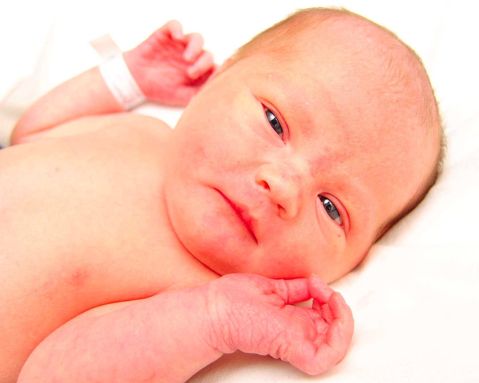 Henry is registered to the contest to win money with this photo: baby, baby_products, cheek, child, close_up, comfort, eye, eyebrow, finger, gesture, happy, head, human_body, lip, nail, nose, person, red, skin, thumb