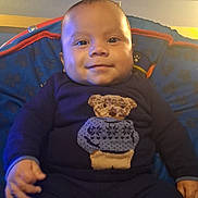 Carlos joined the competition — help win amazing prizes! baby, child, infant, smiling, portrait, sitting, indoors, bouncer, baby_clothing, teddy_bear, onesie, pants, socks, window, furniture, colorful, cozy, face, head, photography