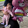 Amaria joined the competition — help win amazing prizes! baby, child, balloon, pink, rainbow, onesie, person, outdoor, bench, grass, concrete, holding, cute, infant, celebration, toy, fun, happy, casual_clothing, park