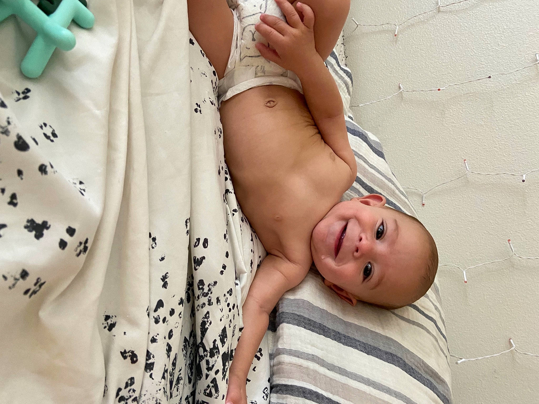 Clark is registered to the contest to win money with this photo: abdomen, baby, chest, child, comfort, elbow, facial_expression, flash_photography, gesture, human_body, human_leg, joy, knee, neck, person, skin, sleeve, stomach, textile, thigh