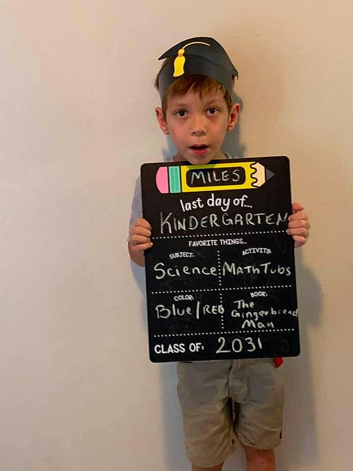 Miles is registered to the contest to win money with this photo: baby_toddler_clothing, cap, child, costume, fashion_design, font, gesture, handwriting, happy, knee, pattern, person, shorts, sleeve, sock, t_shirt, toddler, top, uniform