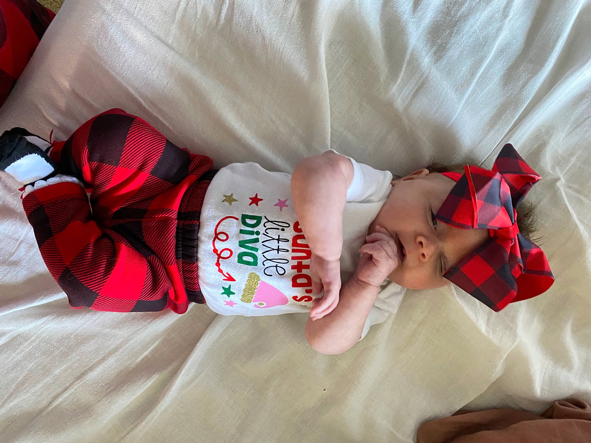 Kassidy is registered to the contest to win money with this photo: arm, baby, baby_products, baby_toddler_clothing, carmine, child, comfort, elbow, finger, hand, headwear, human_body, linens, nail, pattern, person, skin, sleeve, textile, thigh