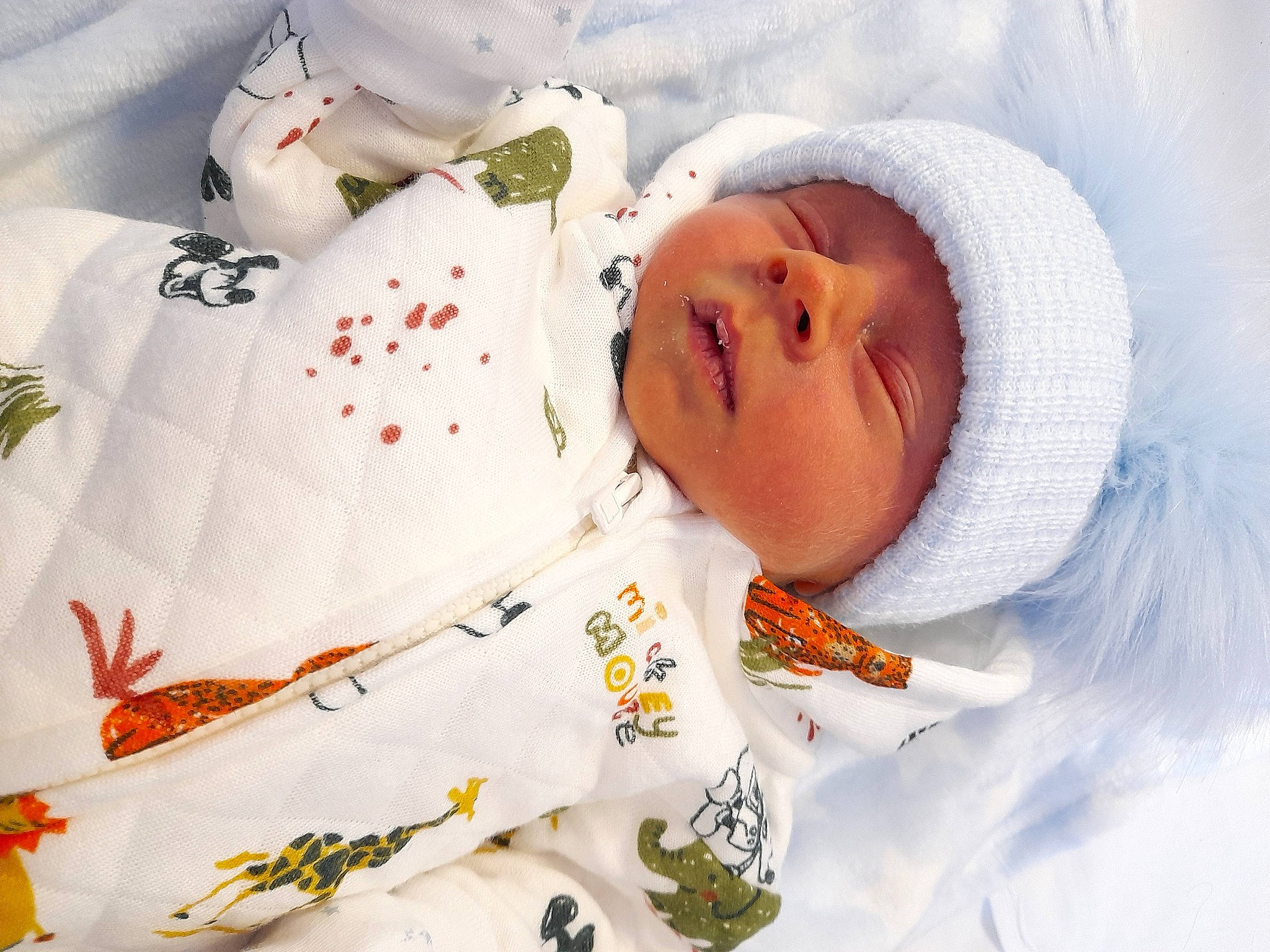 Jack is registered to the contest to win money with this photo: baby, baby_products, baby_safety, baby_sleeping, baby_toddler_clothing, bedding, bedtime, blanket, carmine, child, comfort, happy, hat, headwear, linens, pattern, person, room, sleeve, textile