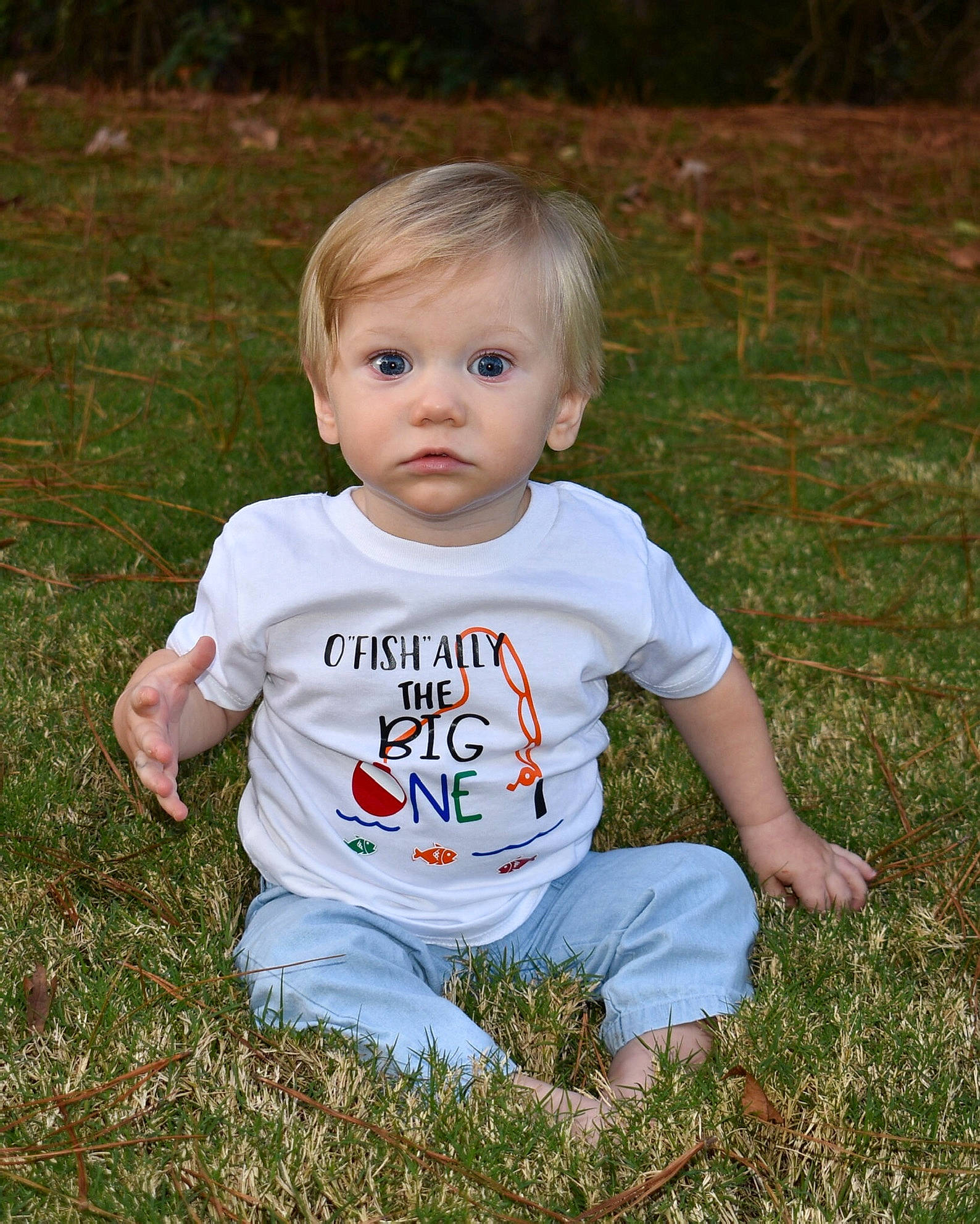 River joined the competition — help win amazing prizes! baby, baby_toddler_clothing, blond, cheek, child, eye, face, grass, grass_family, human, lawn, mammal, meadow, mouth, people_in_nature, person, prairie, skin, summer, toddler