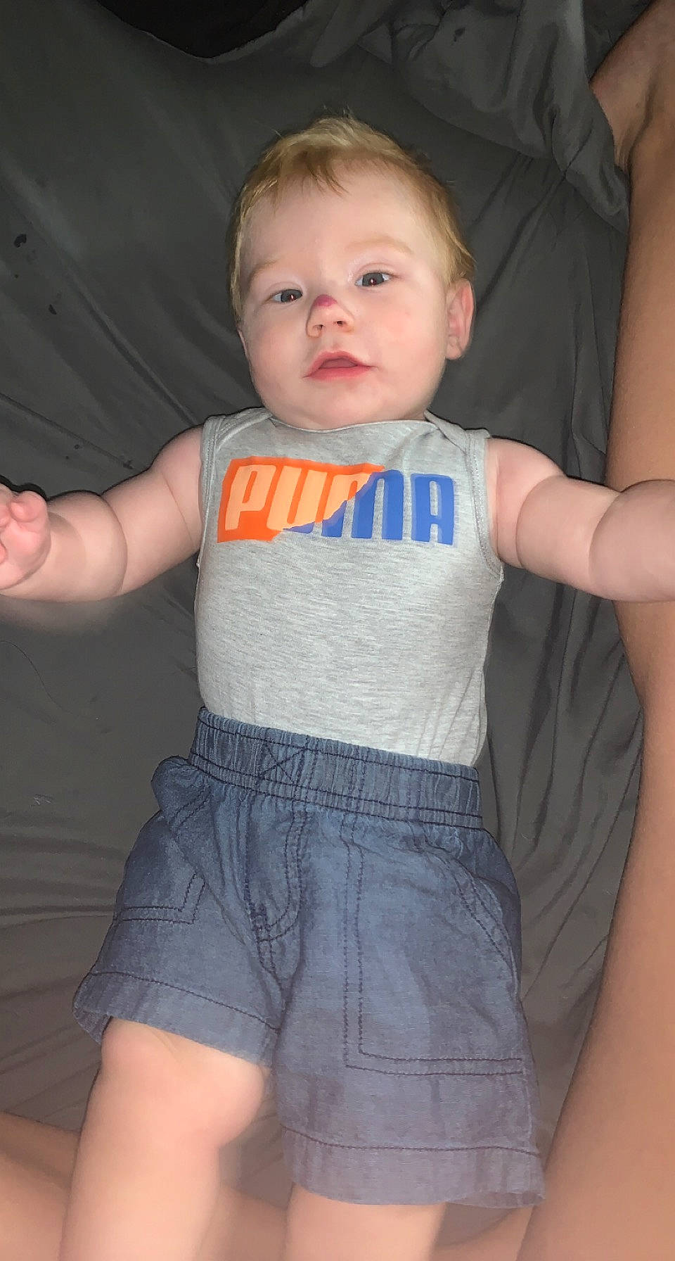 Cyrus is registered to the contest to win money with this photo: baby_toddler_clothing, cheek, chin, eye, gesture, hair, hand, head, human_body, joint, leg, mouth, neck, nose, outerwear, person, shoulder, skin, sleeve, standing