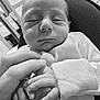 newborn, baby, sleeping, hand, infant, closeup, black_and_white, soft, onesie, tender, peaceful, portrait, human, skin, fingers, care, love, gentle, indoor, family