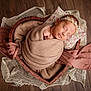 Mia a rejoint le concours — aidez-le/la à gagner de superbes lots ! newborn, baby, sleeping, blanket, headband, pillow, wooden_floor, heart_shaped_bowl, fabric, wrapped, infant, peaceful, portrait, cozy, soft_texture, resting, cute, decor, closeup, indoors