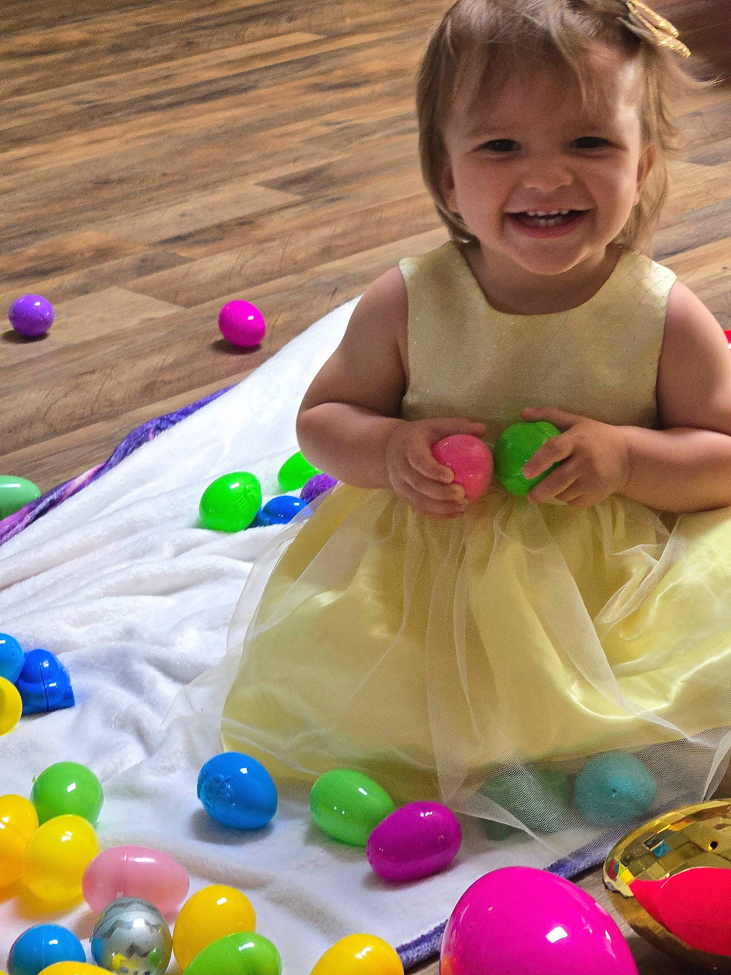 baby, balloon, bodypart, candy, egg, face, finger, food, hand, happy, hardwood, head, person, photography, portrait, purple, smile, sphere, sweets, wood