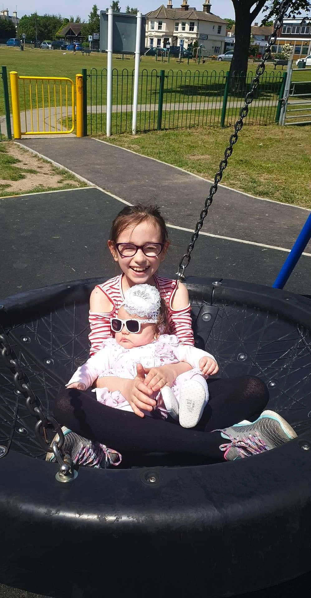 Celine joined the competition — help win amazing prizes! joy, outdoor_play_equipment, person, playground, public_space, swing, trampolining_equipment_and_supplies