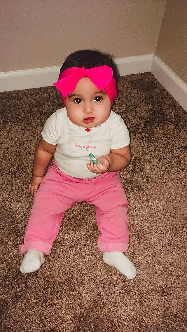 Julyza joined the competition — help win amazing prizes! baby, baby_toddler_clothing, child, hair_accessory, headgear, headwear, person, pink, sitting, skin, smile, toddler