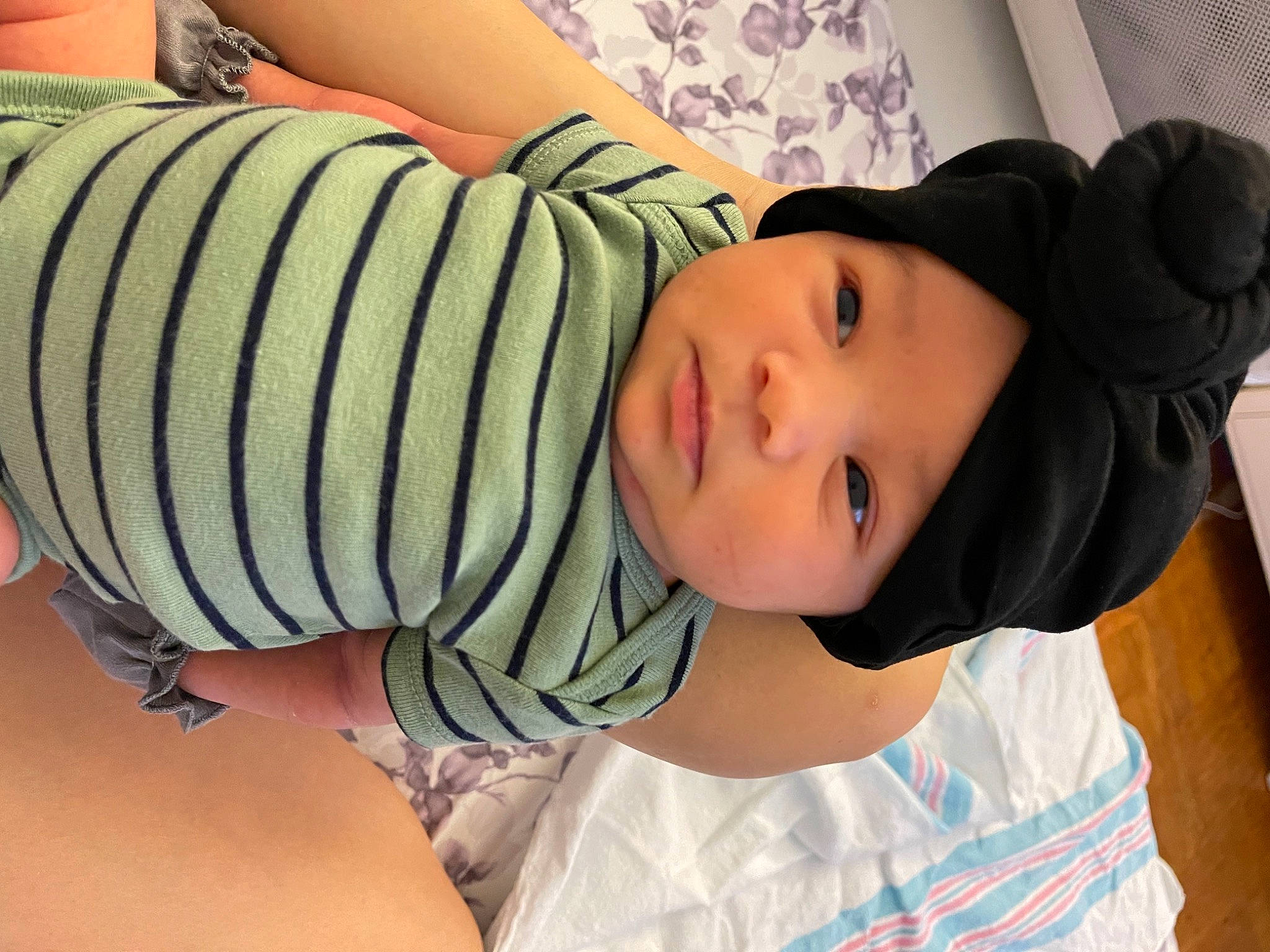 Lena is registered to the contest to win money with this photo: baby, black_hair, cheek, comfort, cool, elbow, finger, happy, hat, headwear, joint, knee, lip, mouth, neck, person, shoulder, skin, sleeve, thigh